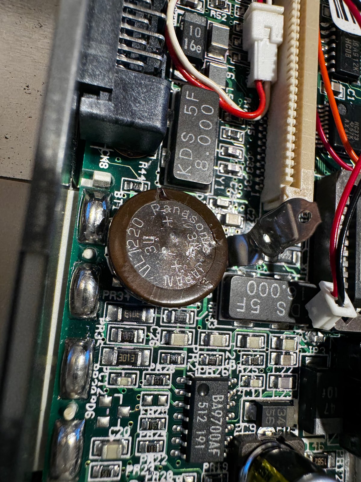 The Panasonic VL1220 CMOS battery on the mainboard The Panasonic VL1220 CMOS battery on the mainboard
