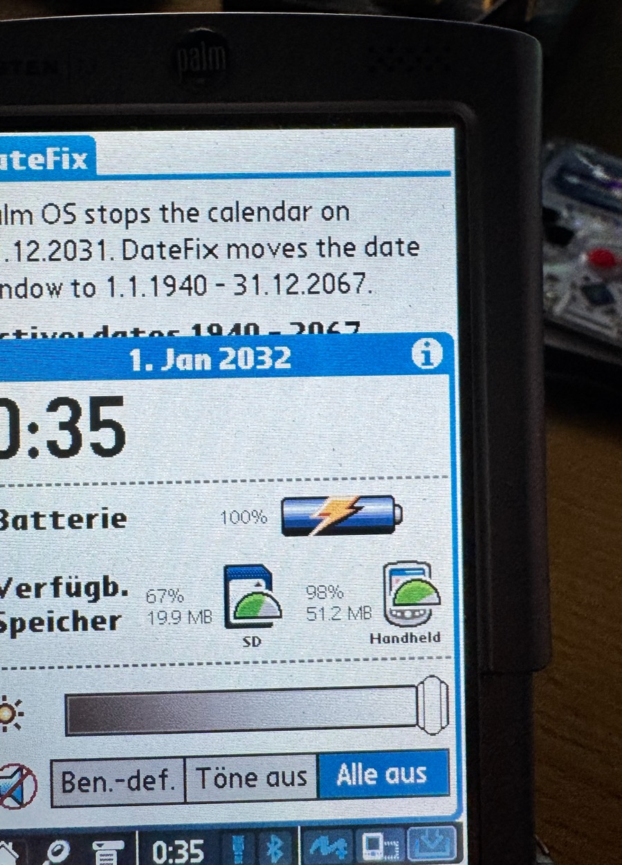 The status bar clock popup shows 
